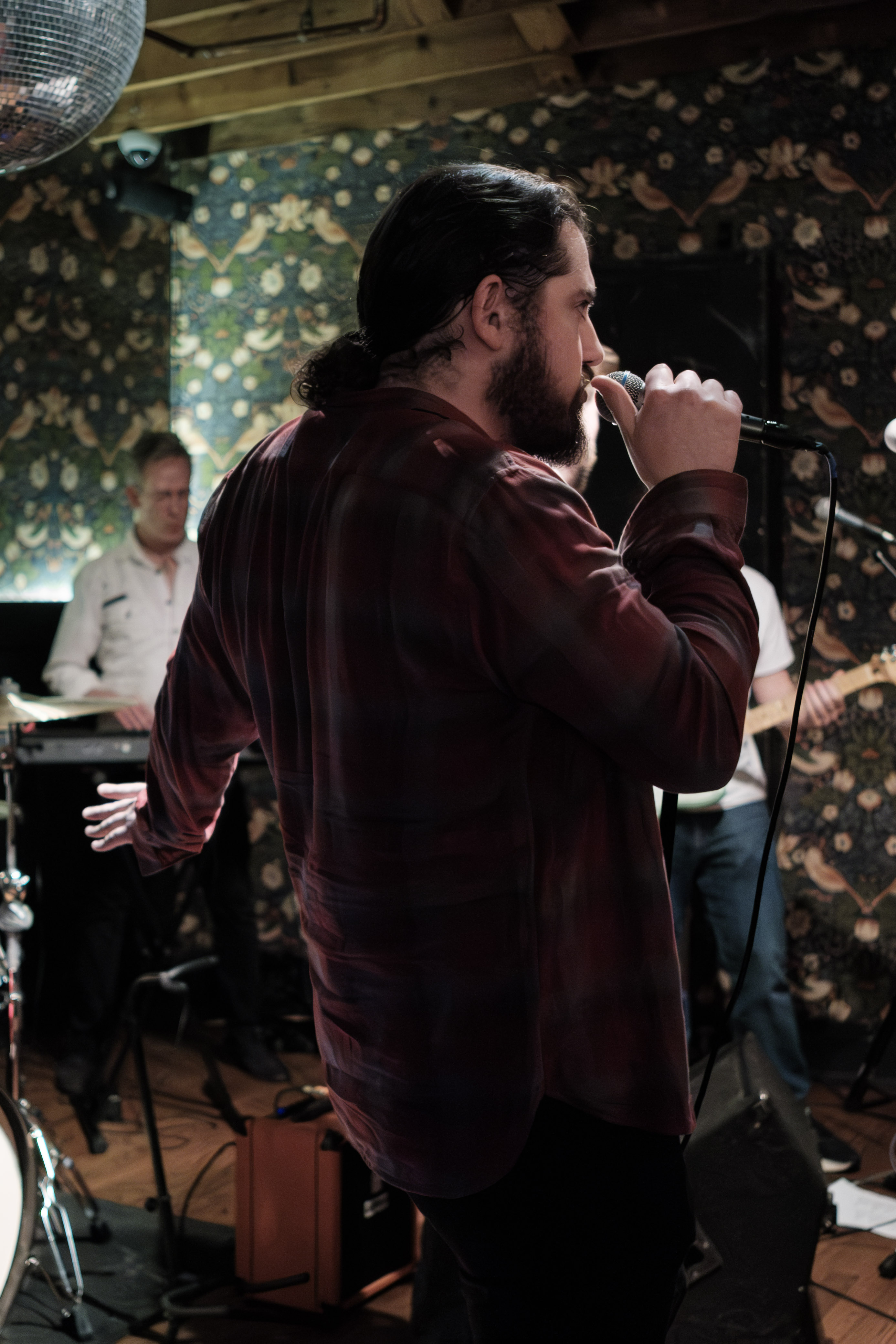 Vocalist in profile, moody side lighting