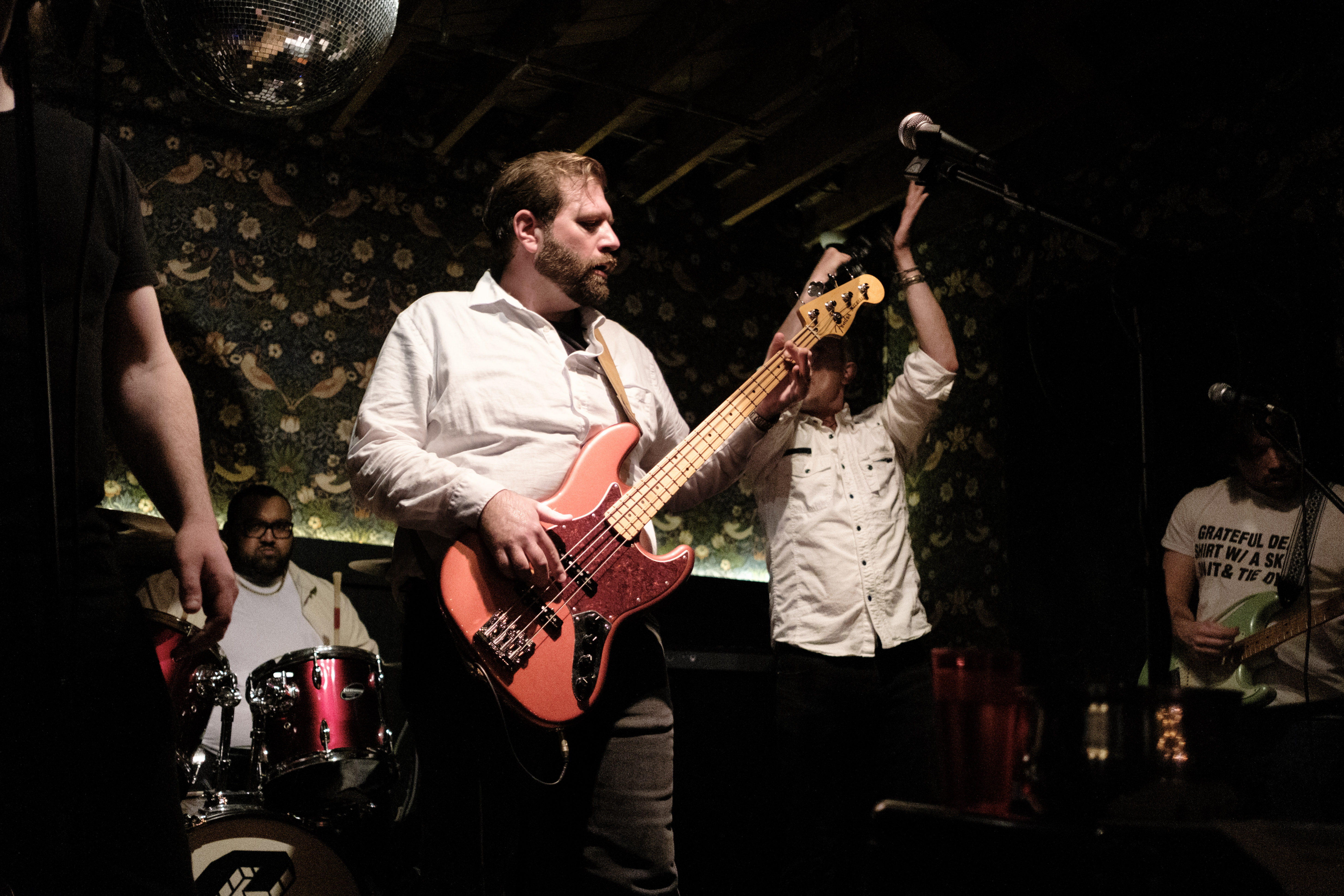 Bassist close-up with red Fender Jazz bass