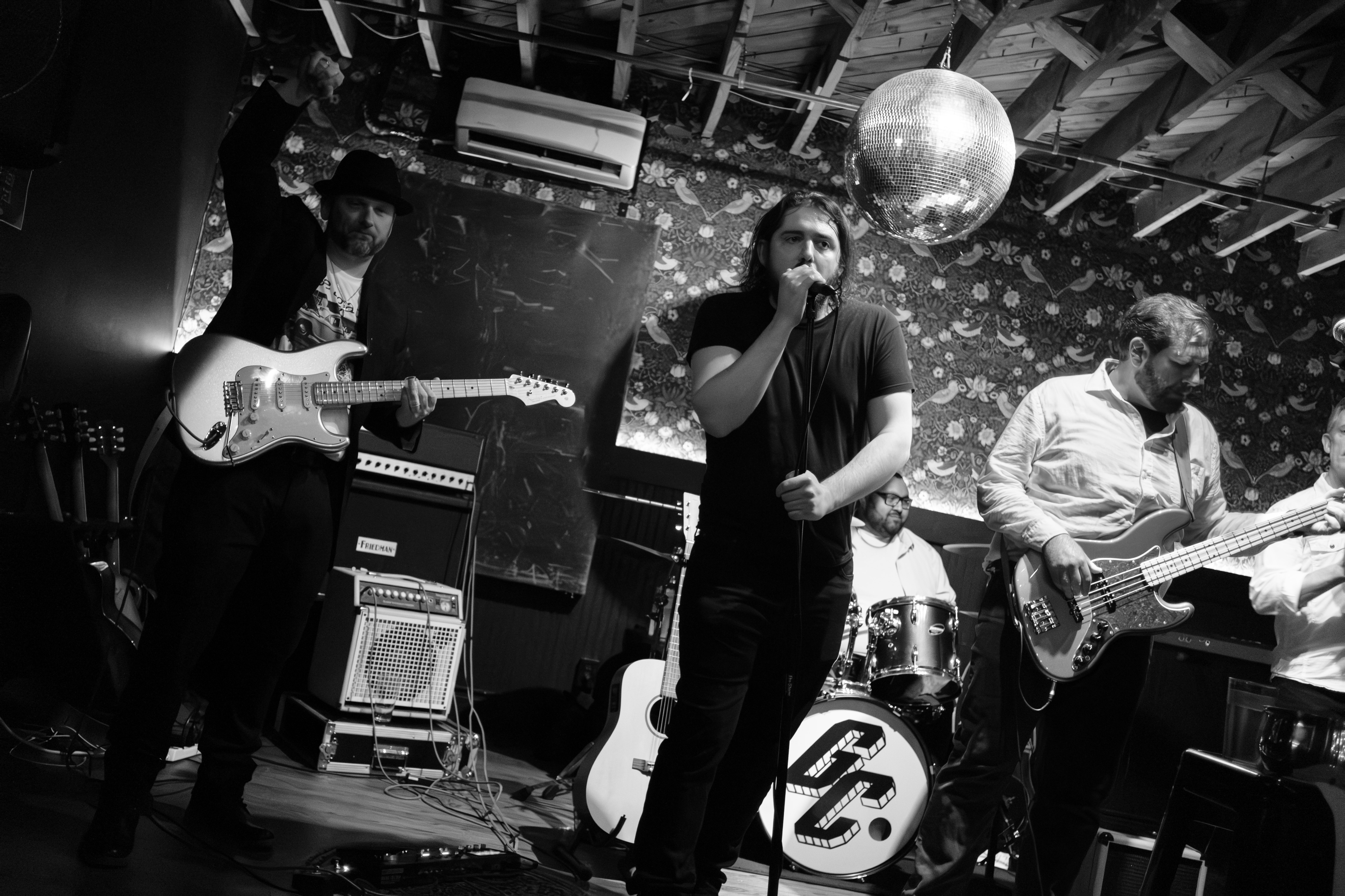 B&W guitarist, vocalist, bassist in action